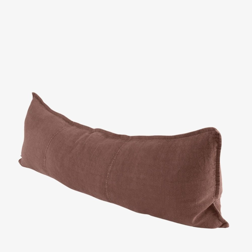 A long, rectangular lumbar pillow in a textured brown fabric, shown at an angle on a plain white background.