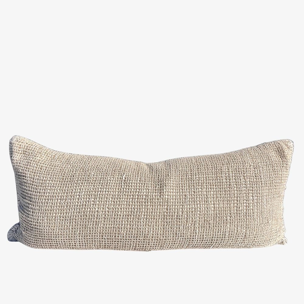 A rectangular lumbar throw pillow in a textured beige woven fabric, shown against a plain white background.