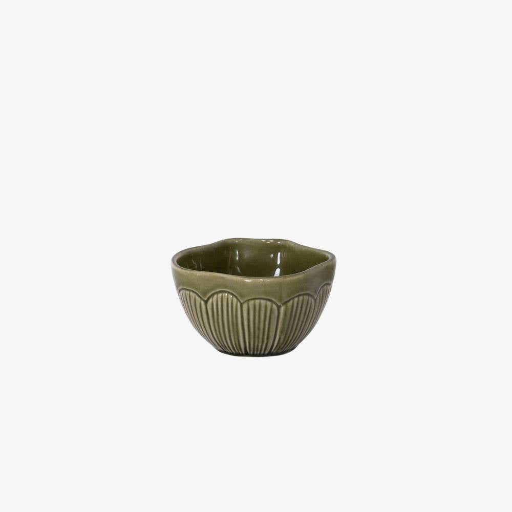 Green ceramic bowl with textured design on a white background
