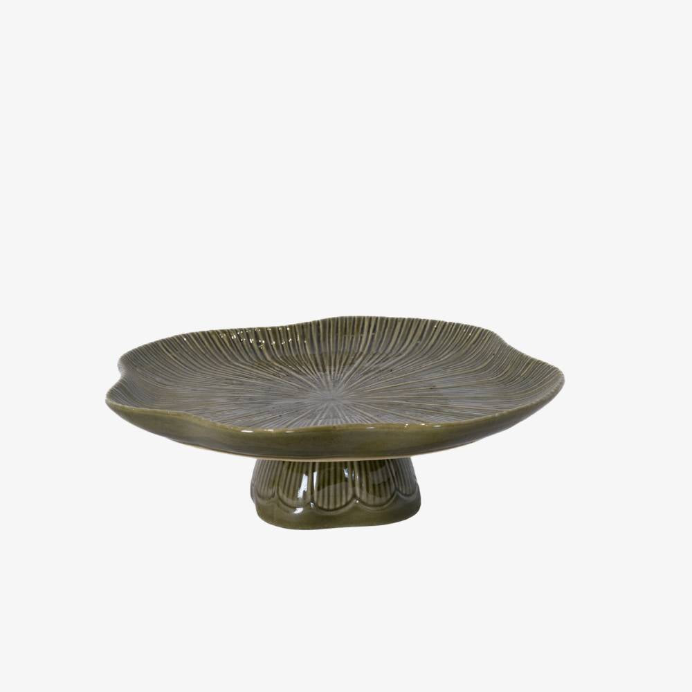 Green ceramic dish on a white background
