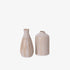 Two ceramic vases with striped design on a white background