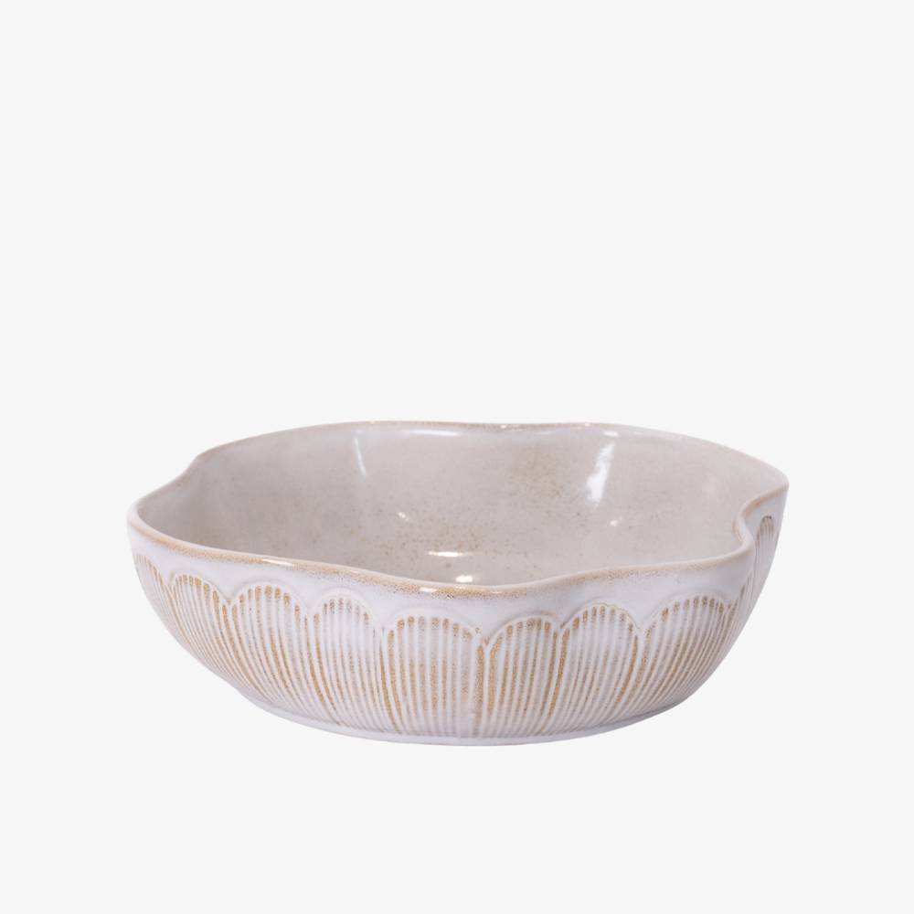 White ceramic bowl with decorative patterns on a white background