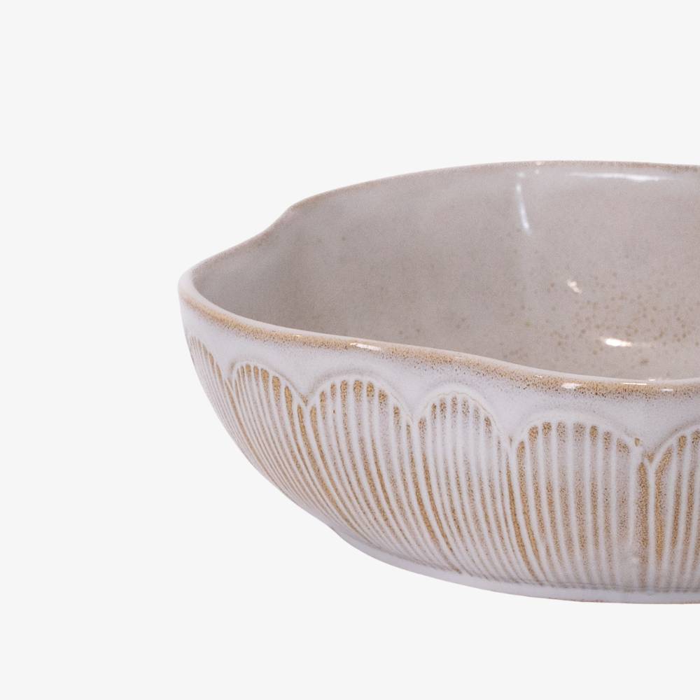 Ceramic bowl with decorative patterns on a white background