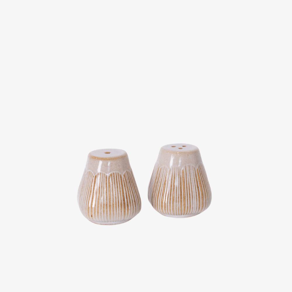 Two ceramic salt and pepper shakers with a textured design on a white background