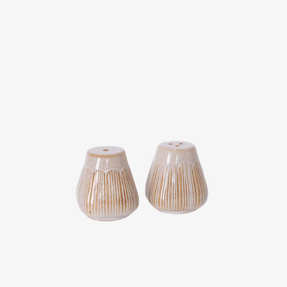 Two ceramic salt and pepper shakers with a textured design on a white background
