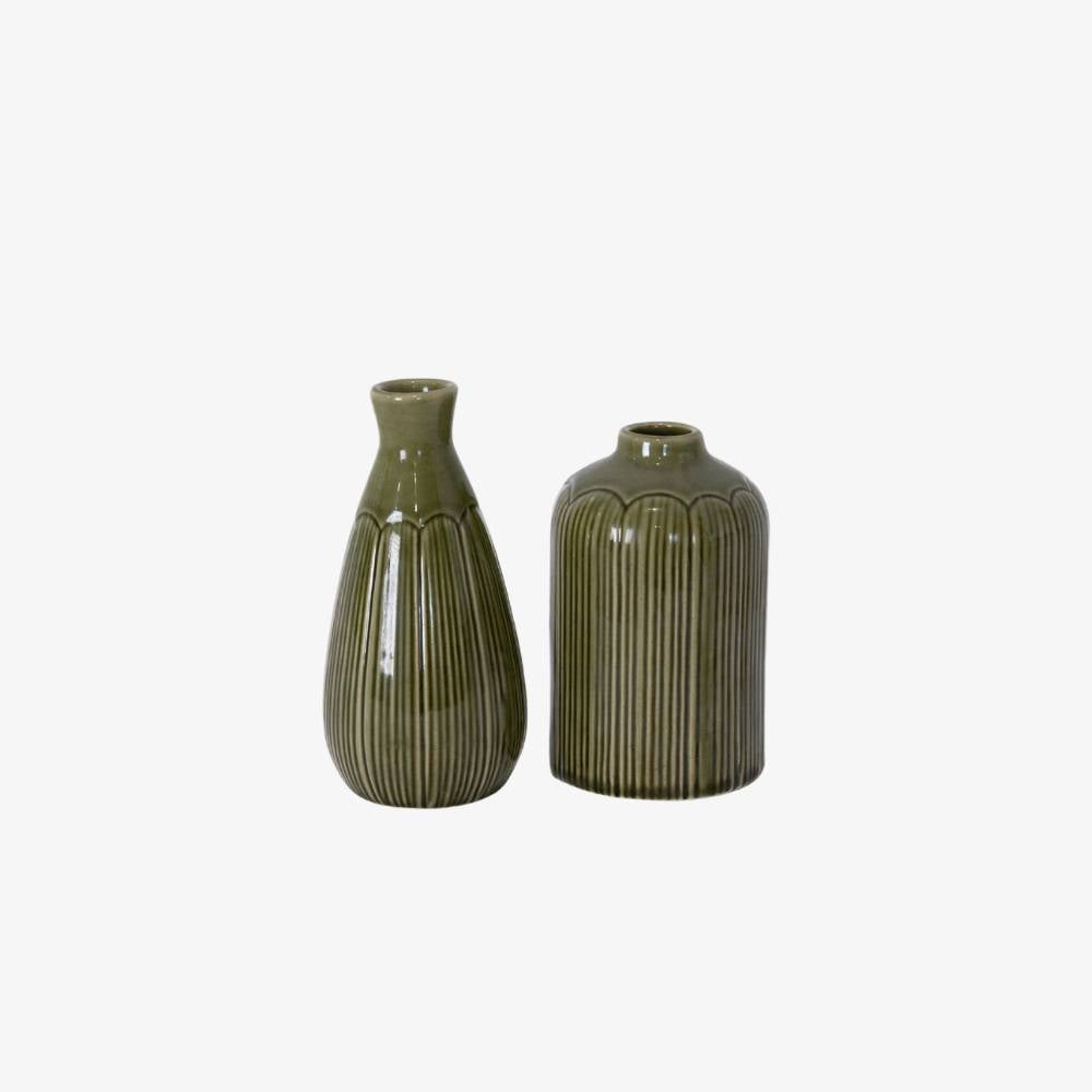 Two green ceramic vases on a white background