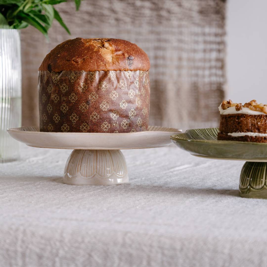 Baked good on a decorative stand with a blurred background