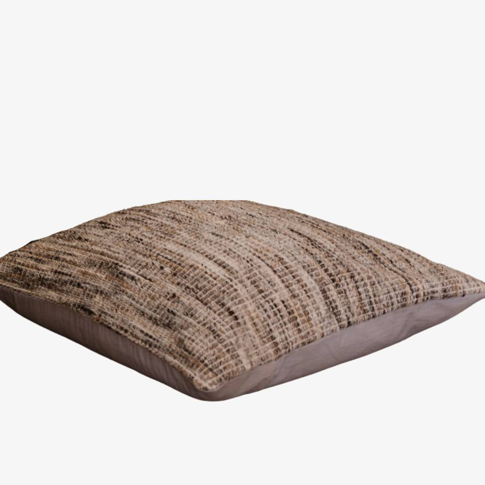 Textured brown cushion on a white background