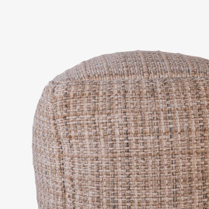 Textured beige ottoman on a white background