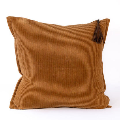 Brown corduroy pillow with a tassel on a white background