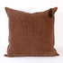 Brown textured pillow with tassels on a white background