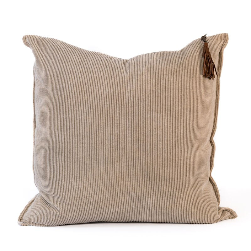 Beige cushion with tassel on a white background