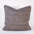 Textured dark pillow on a white background